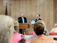 Tom Brauns receiving award from President Steve Sisley