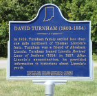 Refurbished David Turnham Plaque in front of Heritage Hills High School