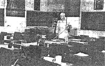 Custodian cleans room at Seminary School